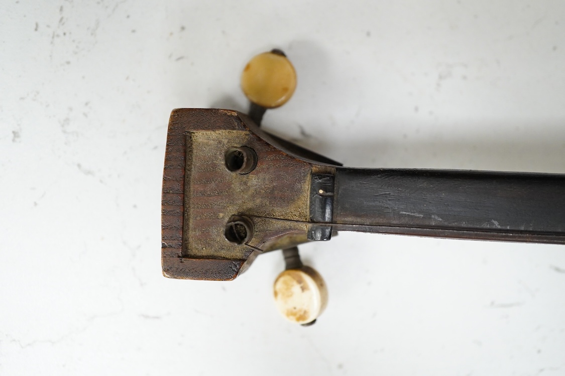 A Mongolian two stringed Morin Khuur musical instrument, 71cm overall